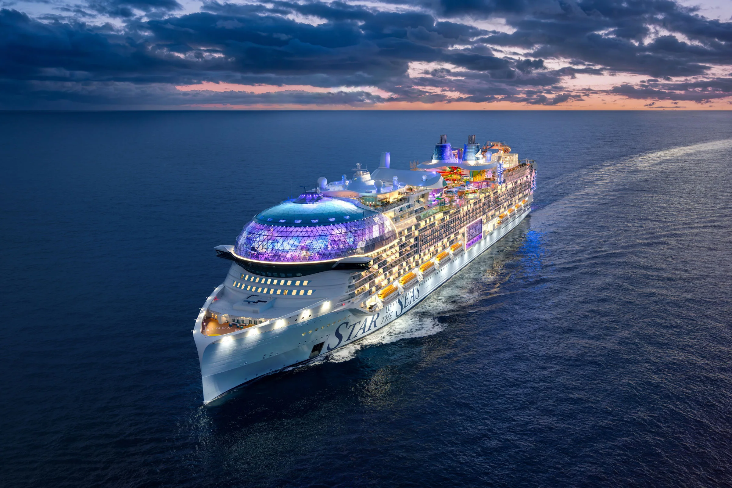 Star of the Seas sailing across the blue ocean at dusk