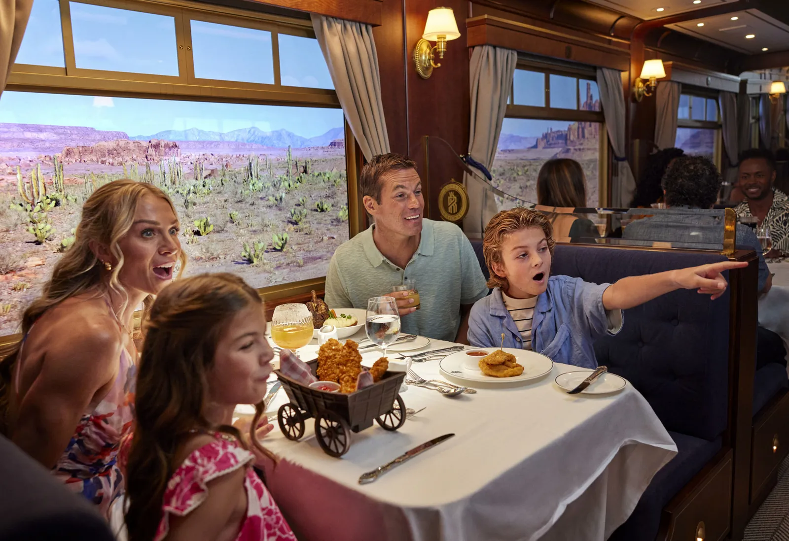 A family dining inside Royal Railway – Utopia Station