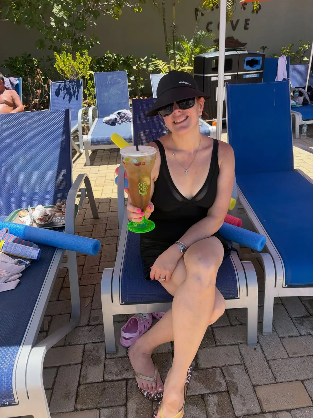 Victoria relaxing poolside on vacation